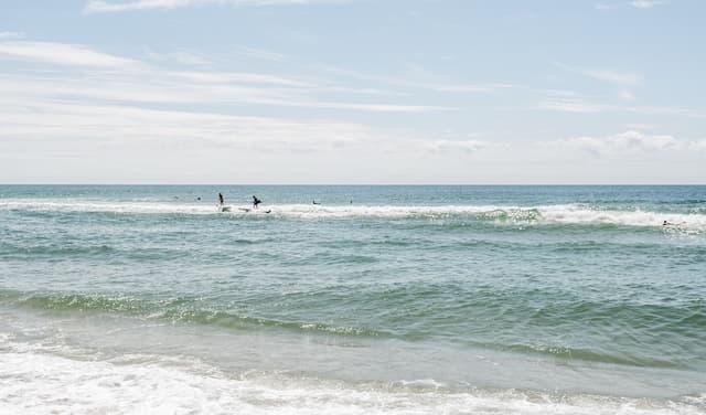 Surfers in waves.
